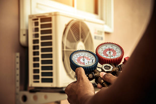 Professional Heat Pump Repair technician working in Bullhead City, AZ